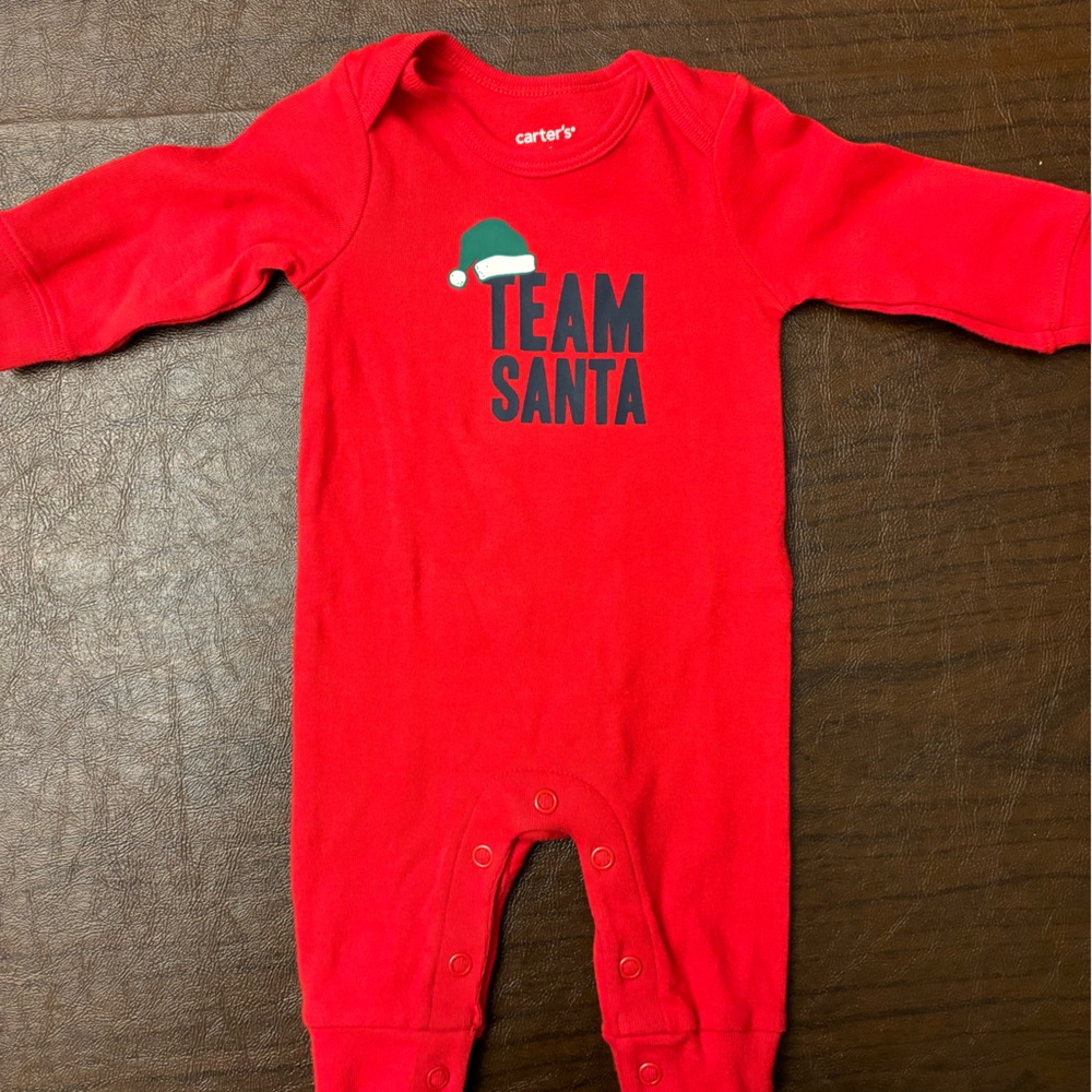 Never worn Newborn Team Santa onesie